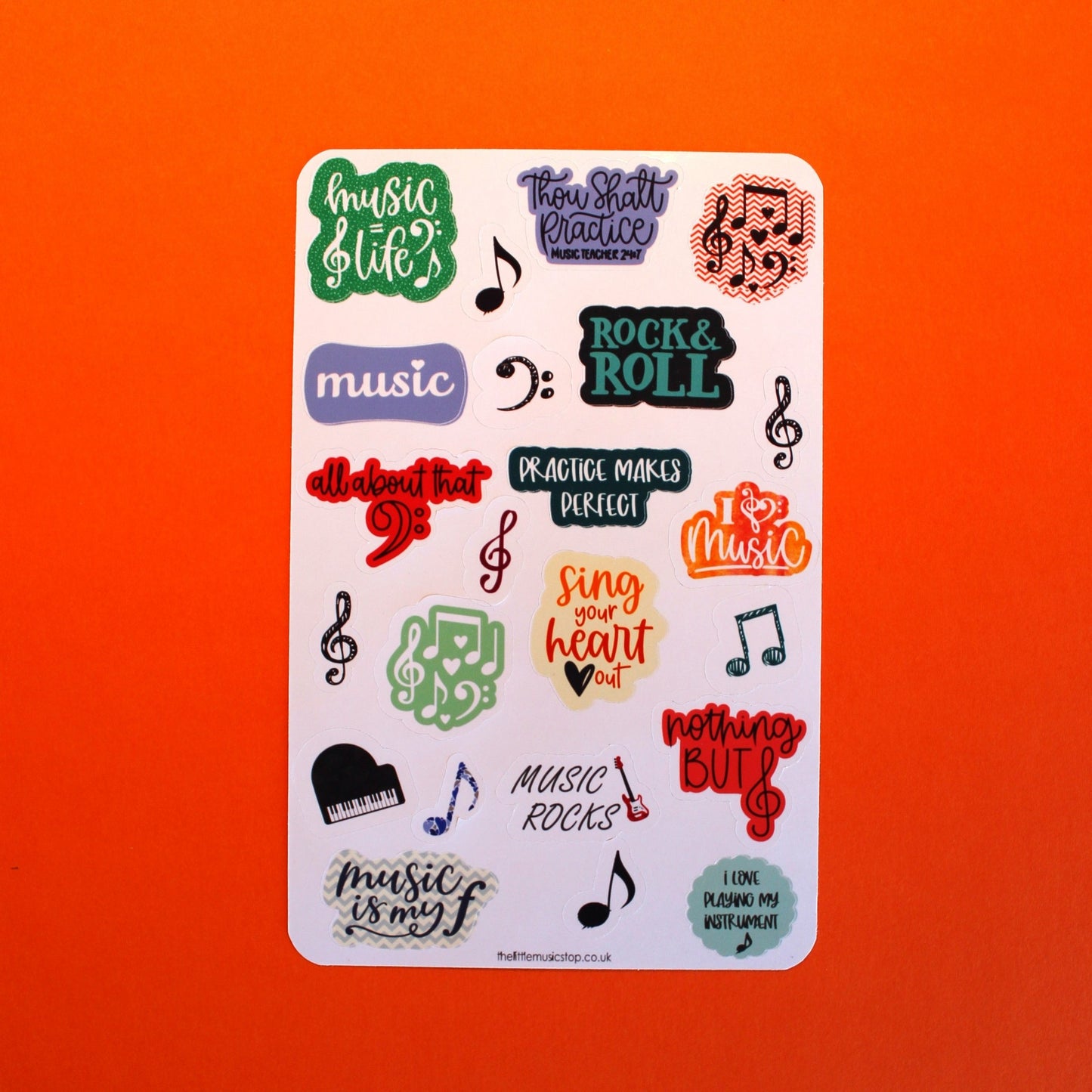 Colourful sheet of stickers some with music slogans and some with symbols