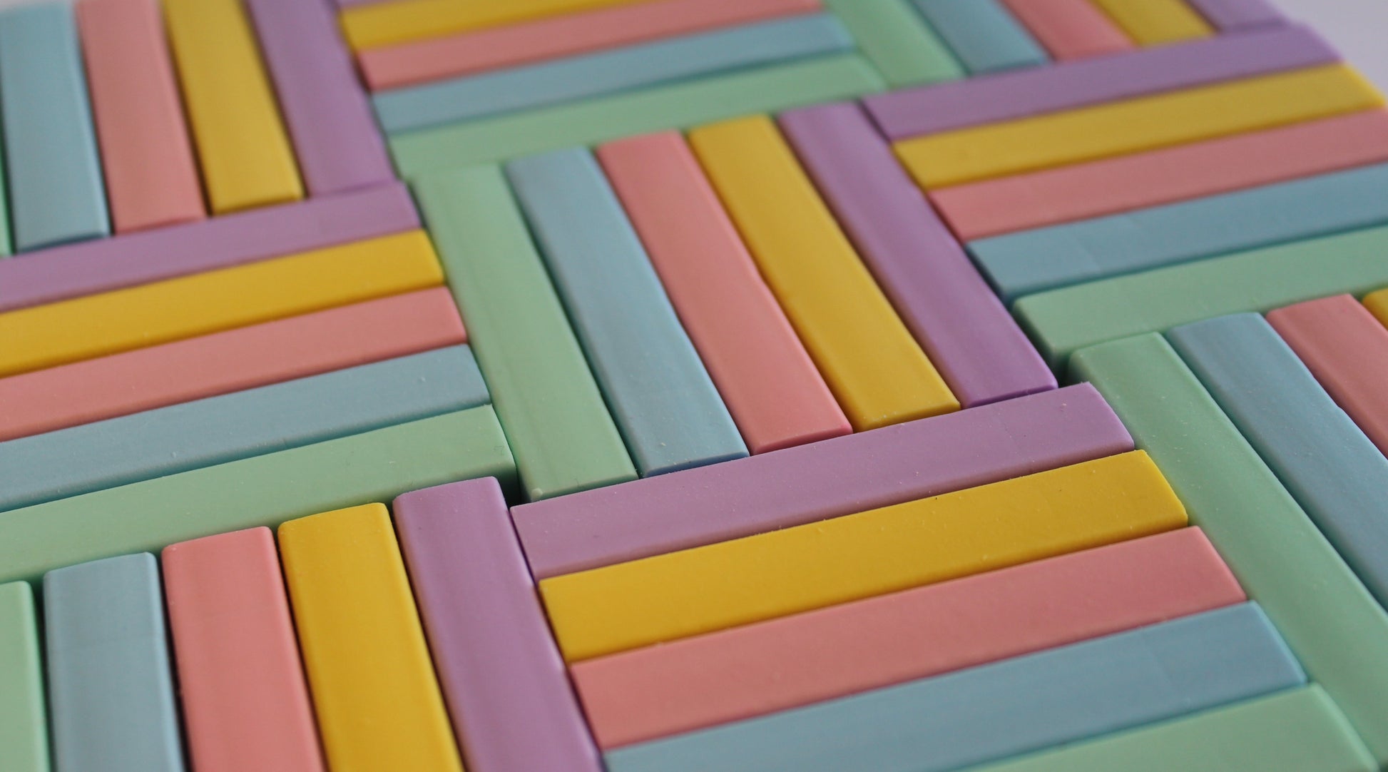 pastel green, blue, pink yellow and purple rubbers in a block design