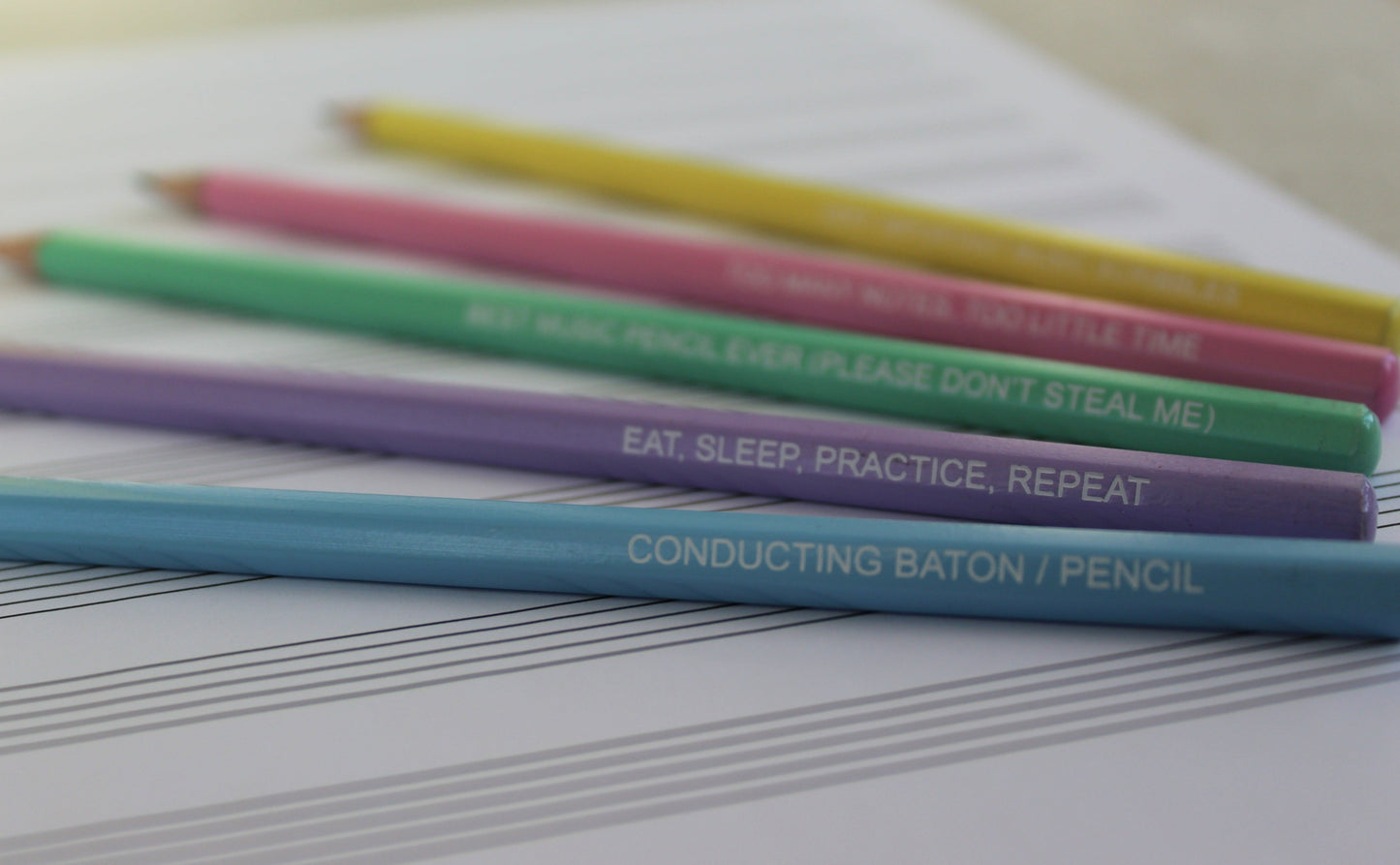 Pastel slogan pencils in blue, purple, green, pink and yellow.