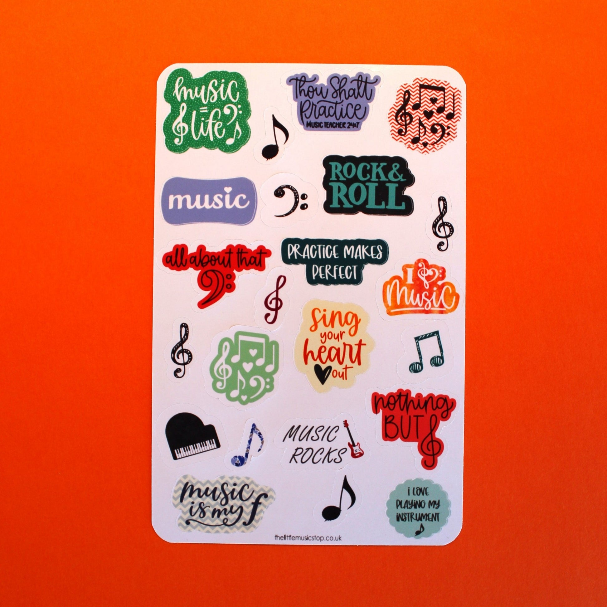 Colourful sheet of stickers some with music slogans and some with symbols