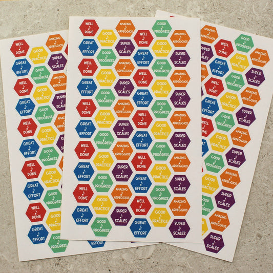 sheets of multicoloured stickers each with a hexagonal design and English wording